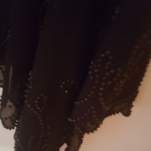 Black evening dress skirt. Beated around the edges